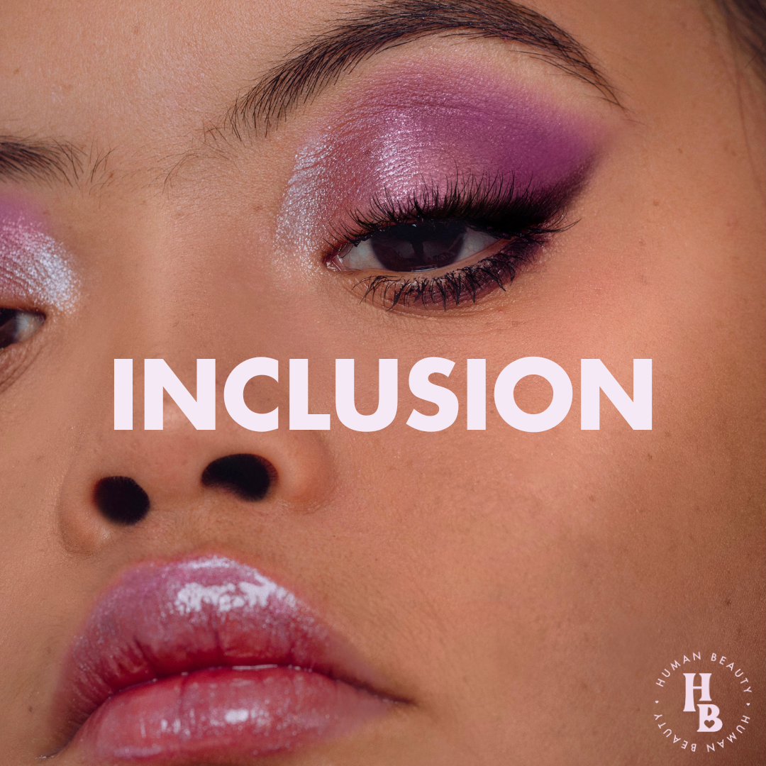 Closeup of a woman with Down Syndrome wearing a shimmery pink eyeshadow look. Text says "Inclusion"
