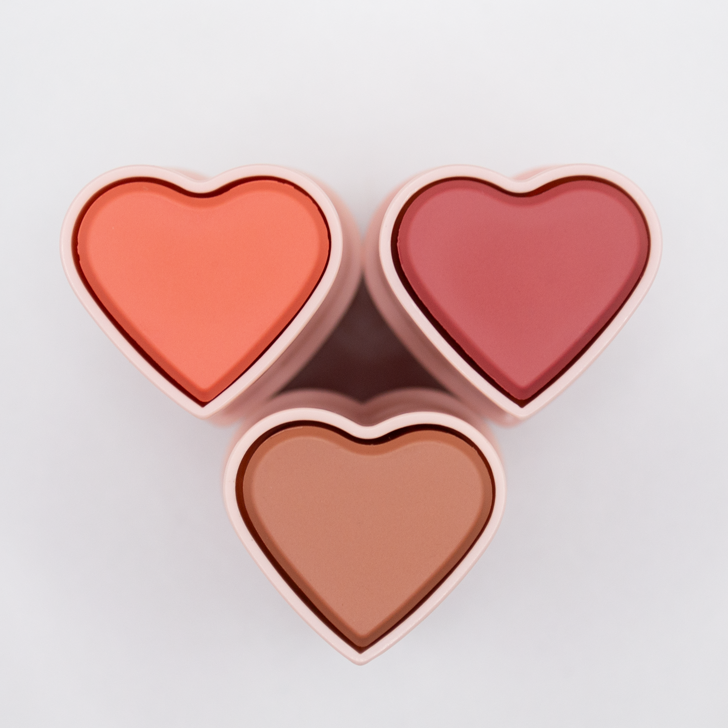 The three Dare To Blush shades of the Signature Neutrals bundle viewed from the top - Confident Coral, Restful Rose and Brilliant Bronze