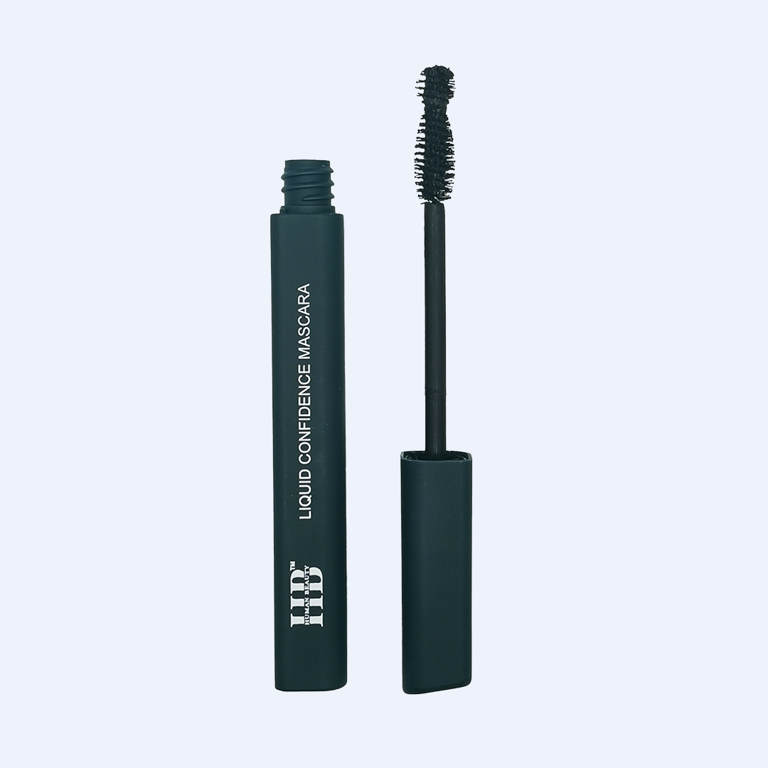 The Liquid Confidence Mascara on a light blue background.