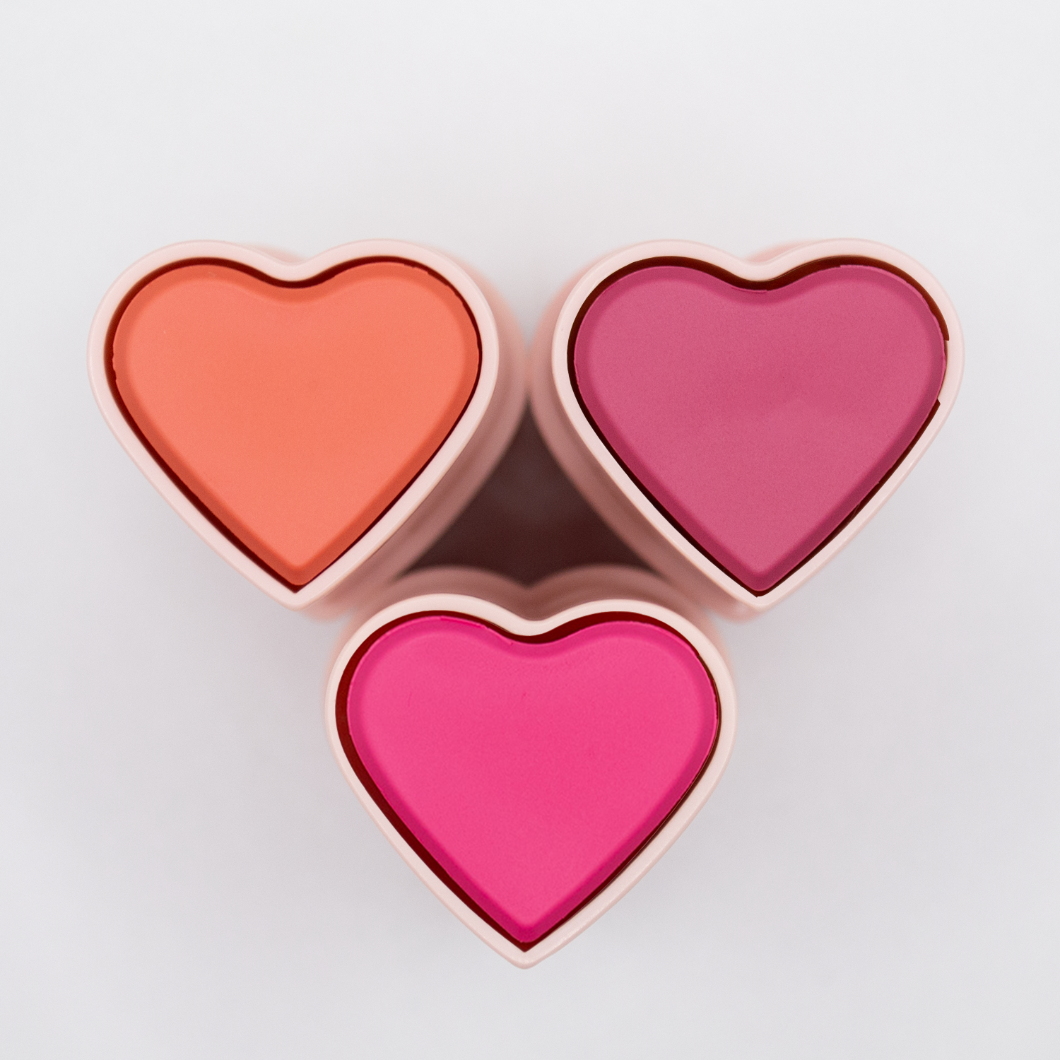 the happy hearts blush trio: shades confident coral, bold berry and protagonist pink